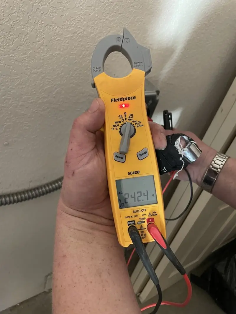 Voltage testing with clamp meter during Ceiling Fan Installation in Redding